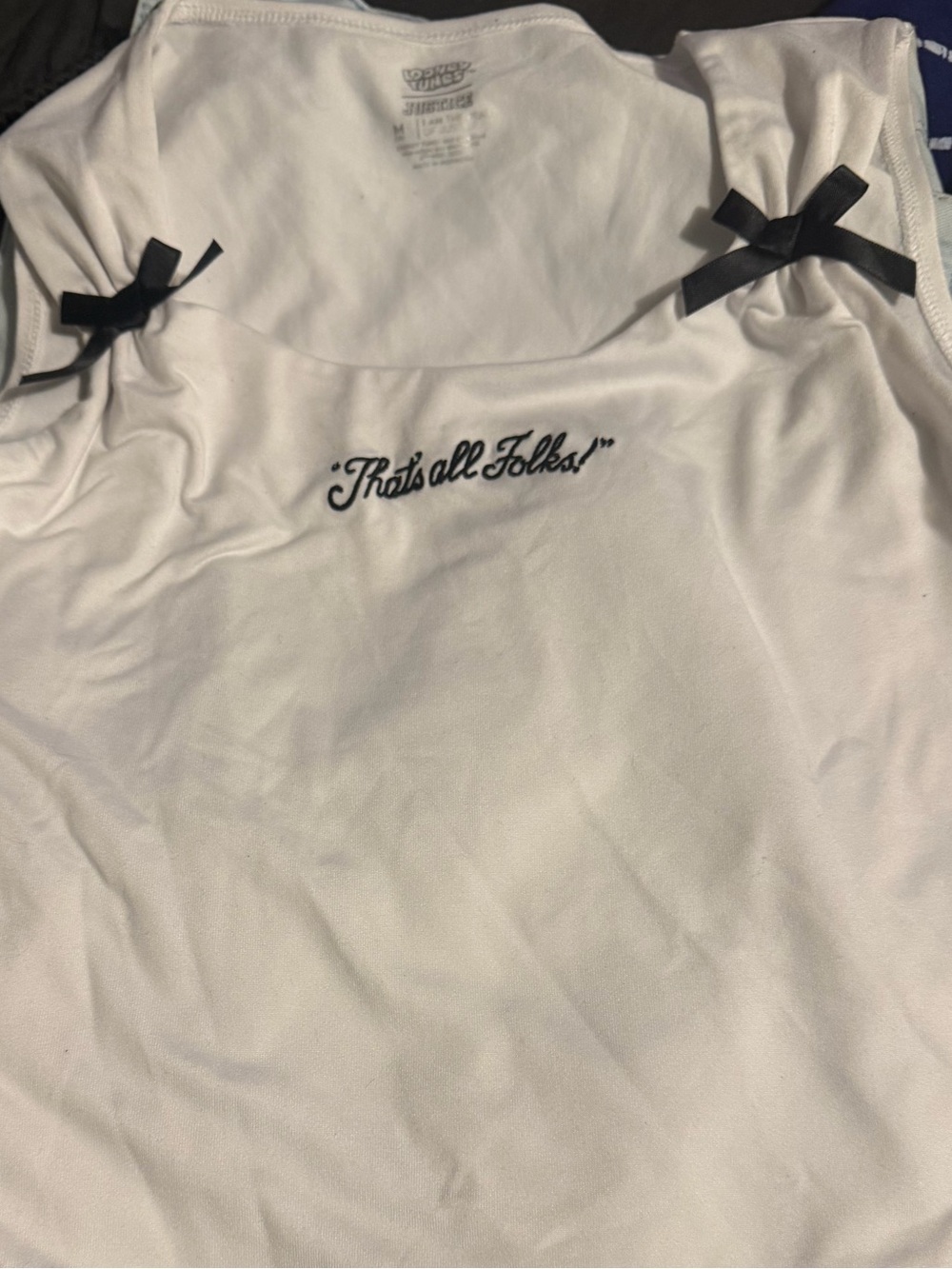 White Sleeveless Tank with "That’s all Folks!" Script and Black Bows